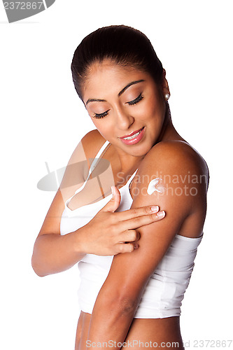 Image of Woman applying Moisturizing lotion