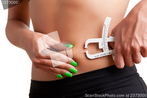 Image of Woman Measuring Body Fat