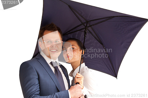 Image of business couple under an umbrella