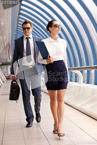 Image of businesswoman and businessman