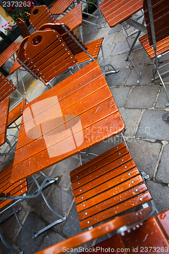 Image of street summer cafe after rain