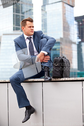 Image of Businessman near office towers