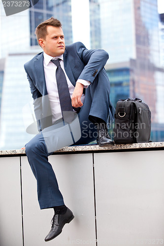 Image of successful businessman resting