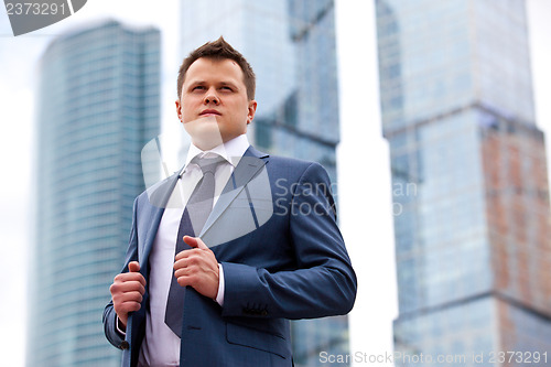 Image of Businessman near office towers