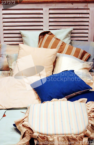 Image of Bed with lots of pillows