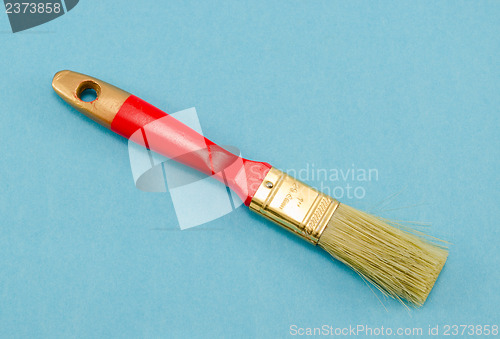 Image of brush 25mm 1" wide red shaft handle paint blue 