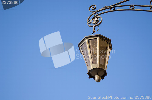 Image of retro iron light lamp background dark blue sky 