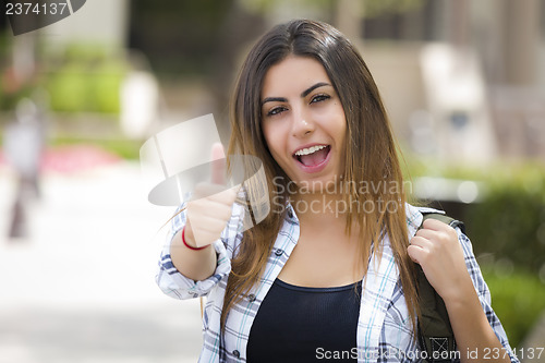 Image of Mixed Race Female Student on School Campus with Thumbs Up