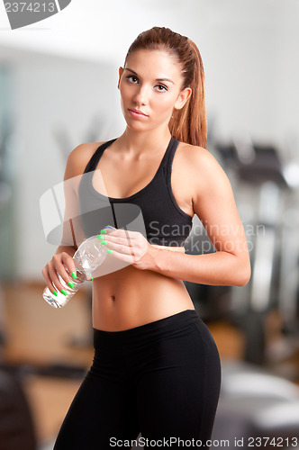 Image of Woman Holding Bottle of Water