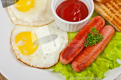 Image of Fried eggs with sausages