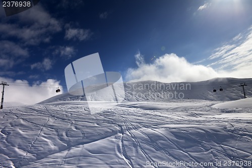 Image of Off-piste ski slope and gondola lift