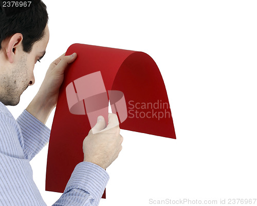 Image of Man holding a paper