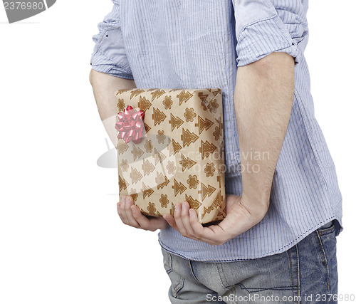 Image of Young man holding a present
