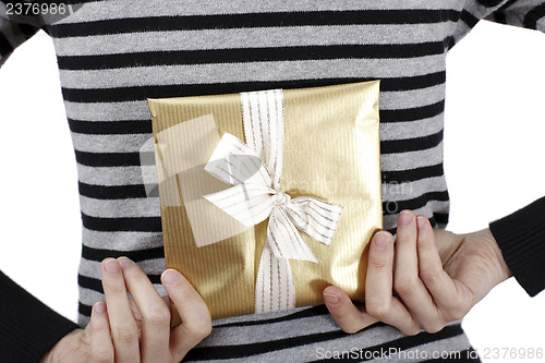 Image of Young woman holding a present