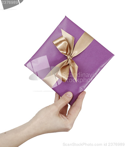 Image of Young woman holding a present