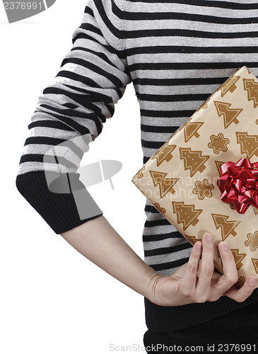 Image of Young woman holding a present