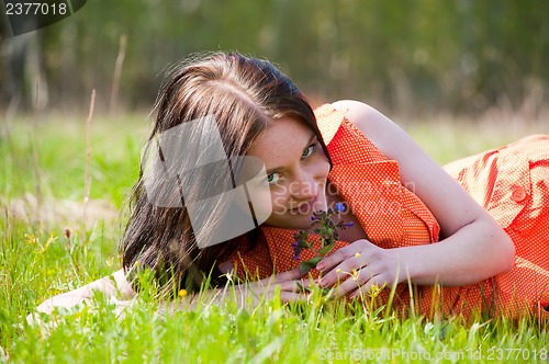 Image of Pretty girl laying on grass