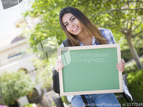 Image of Excited Mixed Race Female Student Holding Blank Chalkboard