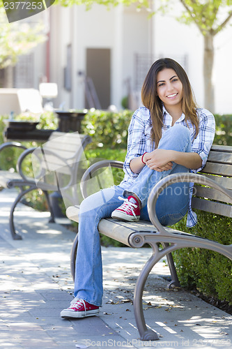 Image of Mixed Race Female Student Portrait on School Campus Bench