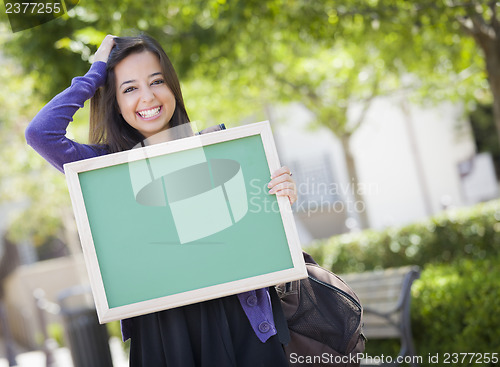 Image of Excited Mixed Race Female Student Holding Blank Chalkboard