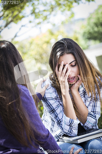 Image of Stressed Sad Young Mixed Race Girl Being Comforted By Friend