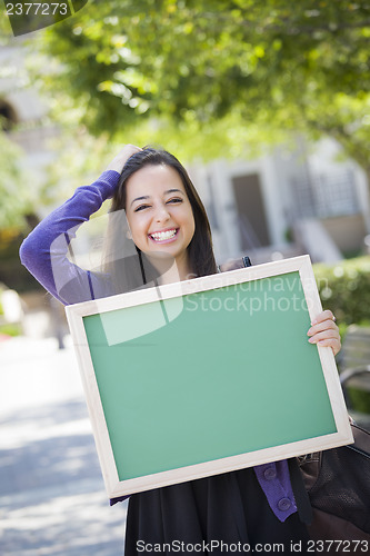 Image of Excited Mixed Race Female Student Holding Blank Chalkboard