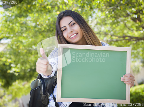 Image of Excited Mixed Race Female Student Holding Blank Chalkboard