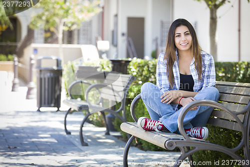 Image of Mixed Race Female Student Portrait on School Campus Bench