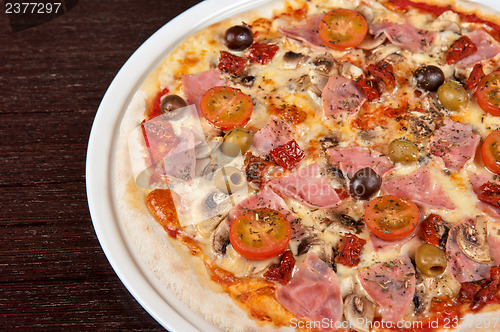 Image of pizza with ham and mushrooms