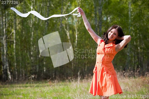 Image of Pretty girl playing with tape