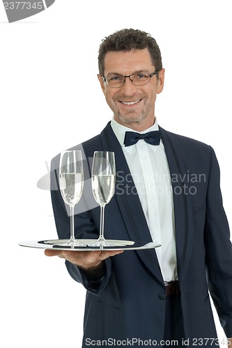 Image of adult male waiter serving two glass of champagne isolated