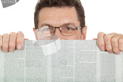 Image of attractive adult businessman reading newspaper isolated