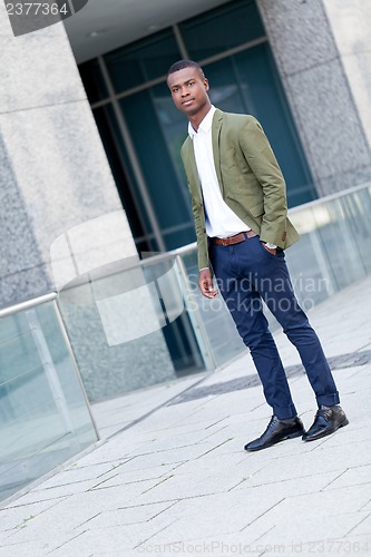 Image of young successful african business man outdoor in summer