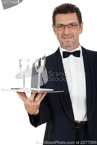 Image of adult male waiter serving two glass of champagne isolated