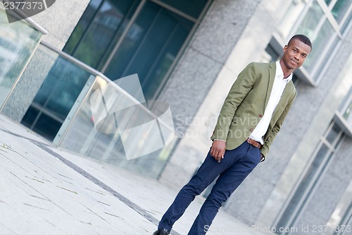Image of young successful african business man outdoor in summer