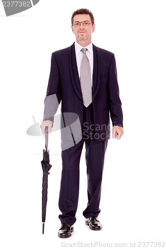 Image of mature attractive business man with umbrella isolated