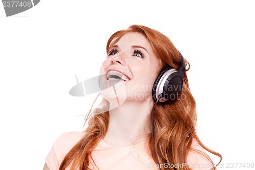 Image of attractive happy woman with headphones listen to music isolated
