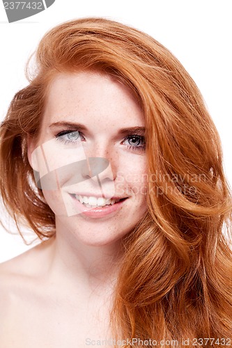 Image of beautiful young redhead woman with freckles portrait