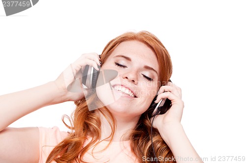 Image of attractive happy woman with headphones listen to music isolated
