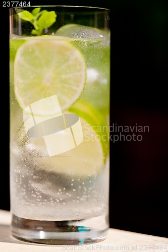 Image of fresh cold refreshment drink mineral water soda with lime and mint