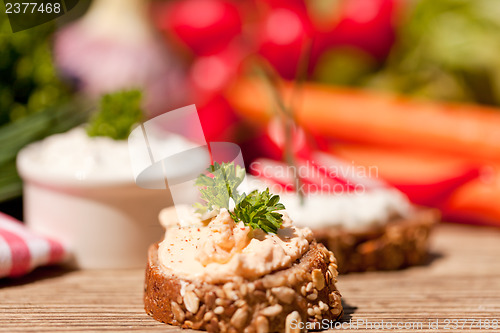 Image of fresh tasty homemade cream cheese and herbs with bread