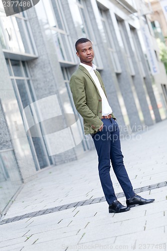 Image of young successful african business man outdoor in summer