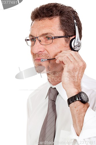 Image of smiling mature male operator businessman with headset call senter