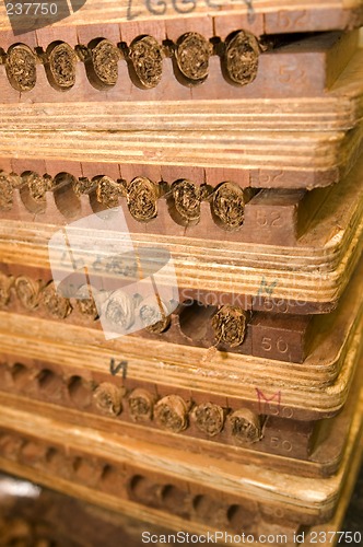 Image of hand made cigars in press storage