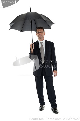 Image of mature attractive business man with umbrella isolated