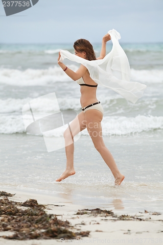 Image of brunette attractive woman carefree on beach summer freedom