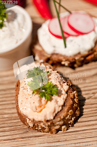 Image of fresh tasty homemade cream cheese and herbs with bread