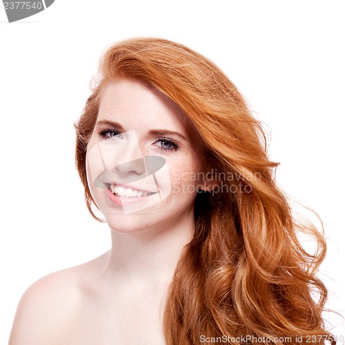 Image of beautiful young redhead woman with freckles portrait