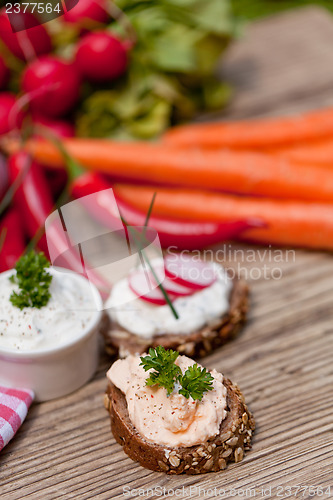 Image of fresh tasty homemade cream cheese and herbs with bread