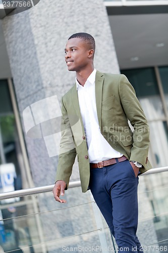 Image of young successful african business man outdoor in summer